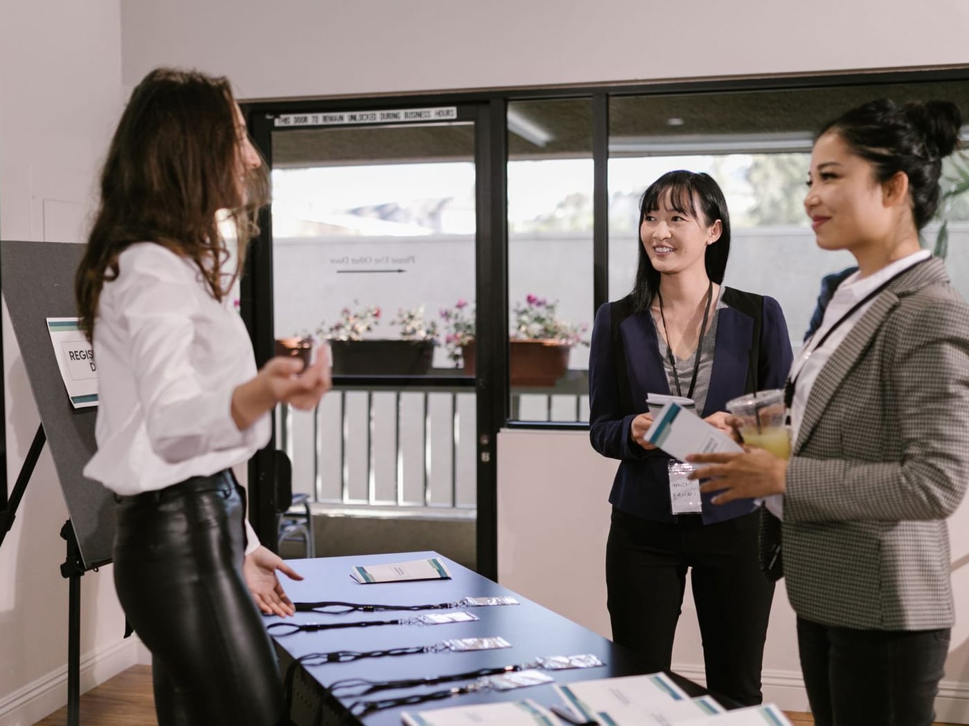 SoftInvites team welcoming guests at an accreditation desk